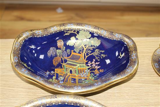 A Carltonware thirty five piece coffee and dessert service, with chinoiserie decoration on a dark blue ground